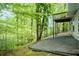 Exterior back view showcasing a back deck, back patio, and lovely view at 2620 Nesbitt Crossing Way, Duluth, GA 30096
