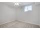 A well-lit room with fresh neutral carpeting and a ceiling fan at 2620 Nesbitt Crossing Way, Duluth, GA 30096