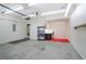 Spacious garage featuring concrete flooring, ample storage, and a functional workspace area at 2620 Nesbitt Crossing Way, Duluth, GA 30096