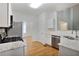 Spacious kitchen with stainless steel appliances and white cabinetry provides ample counter space at 2620 Nesbitt Crossing Way, Duluth, GA 30096
