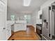 Bright kitchen features stainless steel appliances, white cabinetry, and granite countertops at 2620 Nesbitt Crossing Way, Duluth, GA 30096
