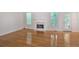 Bright living room featuring hardwood floors, a fireplace and large windows at 2620 Nesbitt Crossing Way, Duluth, GA 30096