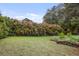 Lush backyard with manicured lawn and mature trees for a private outdoor oasis at 452 Cherokee Ne St, Marietta, GA 30060