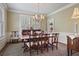 Elegant dining room with shuttered windows, chandelier, and traditional furnishings at 452 Cherokee Ne St, Marietta, GA 30060