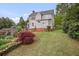 Well-maintained house with mature landscaping, including garden space, and brick accents at 452 Cherokee Ne St, Marietta, GA 30060