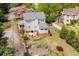 Charming two-story home with a backyard featuring a patio and lush landscaping with mature trees at 452 Cherokee Ne St, Marietta, GA 30060
