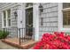 Classic front door featuring sidelights, a decorative transom, and a brick pathway, enhancing its curb appeal at 452 Cherokee Ne St, Marietta, GA 30060