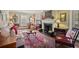 Inviting living room with fireplace, plush seating, and antique decor at 452 Cherokee Ne St, Marietta, GA 30060