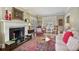 Cozy living room with a fireplace, comfortable seating, and classic decorations at 452 Cherokee Ne St, Marietta, GA 30060