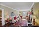 Spacious living room features plush seating, patterned rug, and decorative fireplace at 452 Cherokee Ne St, Marietta, GA 30060
