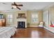 Light-filled main bedroom with hardwood floors, fireplace and mantle, shuttered windows, and bright natural light at 452 Cherokee Ne St, Marietta, GA 30060