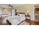 Spacious main bedroom with a seating nook, hardwood floors, an adjacent bathroom, and large windows at 452 Cherokee Ne St, Marietta, GA 30060