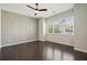 Spacious bedroom with large windows and hardwood flooring, offering ample natural light and a sleek design at 6442 Canopy Dr, Sandy Springs, GA 30328