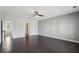 Expansive bedroom featuring hardwood floors, neutral paint, and a modern ceiling fan at 6442 Canopy Dr, Sandy Springs, GA 30328