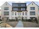 Beautiful multi-story condo building with brick facade and manicured landscaping at 6442 Canopy Dr, Sandy Springs, GA 30328