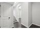 Hallway with wood floors and white door at 6442 Canopy Dr, Sandy Springs, GA 30328