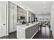 Modern kitchen featuring gray cabinets, stainless steel appliances, and a central island at 6442 Canopy Dr, Sandy Springs, GA 30328