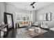 Cozy living room with a decorative rug, comfortable seating, and large windows for natural light at 6442 Canopy Dr, Sandy Springs, GA 30328