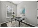 Bright office with glass desk and modern art at 6442 Canopy Dr, Sandy Springs, GA 30328