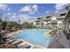 Resort-style pool surrounded by lounge chairs and lush landscaping at 6442 Canopy Dr, Sandy Springs, GA 30328