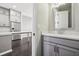 Stylish powder room with a white countertop vanity, modern lighting, and contemporary fixtures at 6442 Canopy Dr, Sandy Springs, GA 30328
