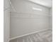 Walk-in closet featuring carpeting, wire shelving and a small window for natural light at 6442 Canopy Dr, Sandy Springs, GA 30328