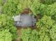 An aerial view showcases the home's layout, lush landscaping, and private setting at 0 Chattahoochee St, Roswell, GA 30075