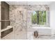Stunning bathroom featuring a modern shower, soaking tub, and marble finishes at 0 Chattahoochee St, Roswell, GA 30075
