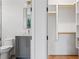 Well-lit bathroom features a sleek vanity and walk-in closet at 0 Chattahoochee St, Roswell, GA 30075