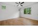 Spacious bedroom with hardwood floors, offering natural light and a view of the surrounding greenery at 0 Chattahoochee St, Roswell, GA 30075