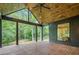Wood beamed covered patio with a ceiling fan overlooking a private, wooded backyard at 0 Chattahoochee St, Roswell, GA 30075