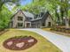 Beautiful new construction features a landscaped yard, rock border and long driveway at 0 Chattahoochee St, Roswell, GA 30075