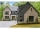 Stunning new construction boasts a stylish mix of brick and dark siding at 0 Chattahoochee St, Roswell, GA 30075