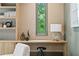 Well-appointed home office with custom built-ins, a sleek desk, and natural light at 0 Chattahoochee St, Roswell, GA 30075