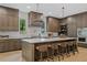 Stylish kitchen with an oversized island, pendant lights, and stainless steel appliances at 0 Chattahoochee St, Roswell, GA 30075