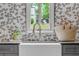 Laundry room features patterned wallpaper, a farmhouse sink, and gray cabinets, exuding a modern, cozy feel at 0 Chattahoochee St, Roswell, GA 30075