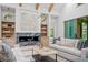 Modern living room featuring a fireplace with bookshelves, contemporary decor and sofas at 0 Chattahoochee St, Roswell, GA 30075