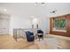 A loft featuring hardwood floors, natural light, two chairs and a window seat for reading at 0 Chattahoochee St, Roswell, GA 30075