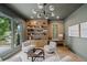 Stylish sitting room with large window, custom shelving, and plush accent chairs at 0 Chattahoochee St, Roswell, GA 30075