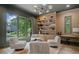 Sitting room with large windows, built-in bookshelves, and comfortable accent chairs at 0 Chattahoochee St, Roswell, GA 30075
