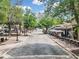 Charming street view with outdoor dining, tree lined road, and a vibrant atmosphere at 0 Chattahoochee St, Roswell, GA 30075
