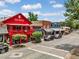 Picturesque street view featuring colorful buildings with outdoor seating and pedestrian-friendly walkways at 0 Chattahoochee St, Roswell, GA 30075