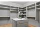 An organized walk-in closet with plenty of shelving and storage space at 0 Chattahoochee St, Roswell, GA 30075