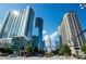 Downtown view of modern glass high-rise buildings against blue sky with cars on the street at 325 E Paces Ferry Ne Rd # 1803, Atlanta, GA 30305