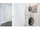 Convenient laundry room with stacked washer and dryer unit, as well as, easy access to unit entrance at 325 E Paces Ferry Ne Rd # 1803, Atlanta, GA 30305