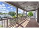 Charming covered balcony with wood floors, wood railings and a view of neighborhood at 1434 Fairmont Ave, Atlanta, GA 30318