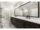 Modern bathroom with double sinks, white countertops, and a large mirror for added light at 1434 Fairmont Ave, Atlanta, GA 30318