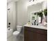 Bathroom features modern fixtures, a dark vanity, and a shower-tub combination at 1434 Fairmont Ave, Atlanta, GA 30318
