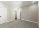 Bright bedroom featuring plush carpet, fresh paint, and white trim leading to multiple doorways at 1434 Fairmont Ave, Atlanta, GA 30318