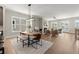 Open concept dining area featuring a modern light fixture, seamlessly connected to the living space at 1434 Fairmont Ave, Atlanta, GA 30318